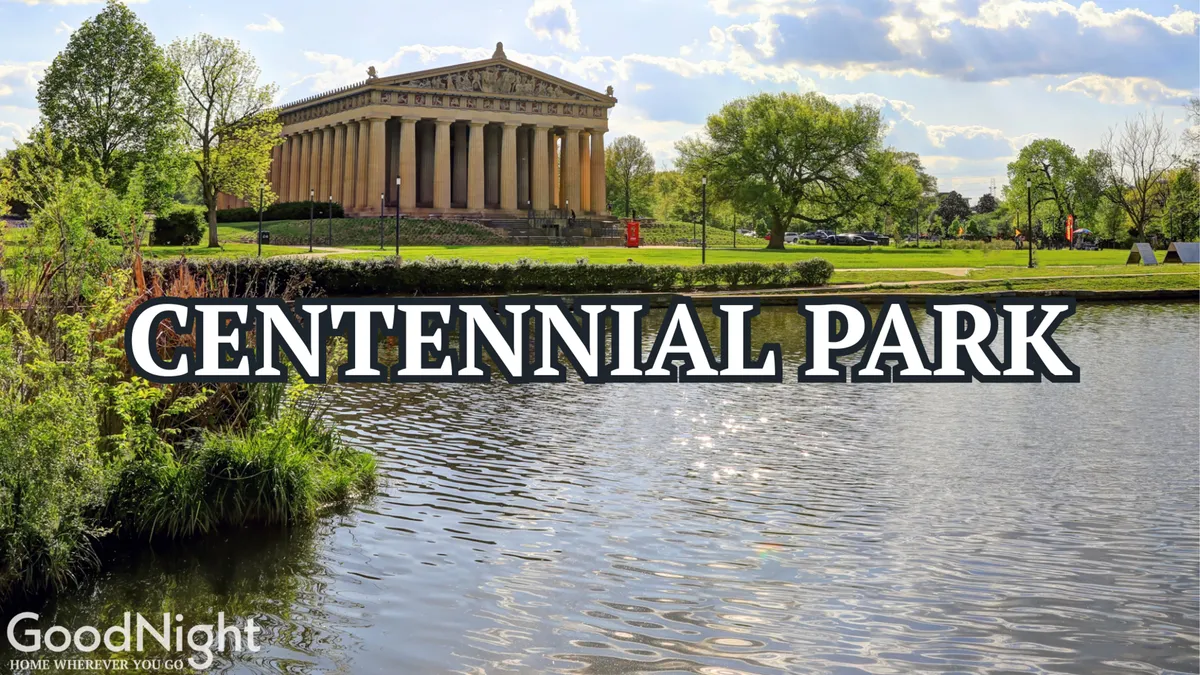This image captures The Parthenon in Nashville, reflected in a serene body of water and surrounded by lush greenery. The setting is tranquil and inviting, ideal for family strolls, picnics, and photography.